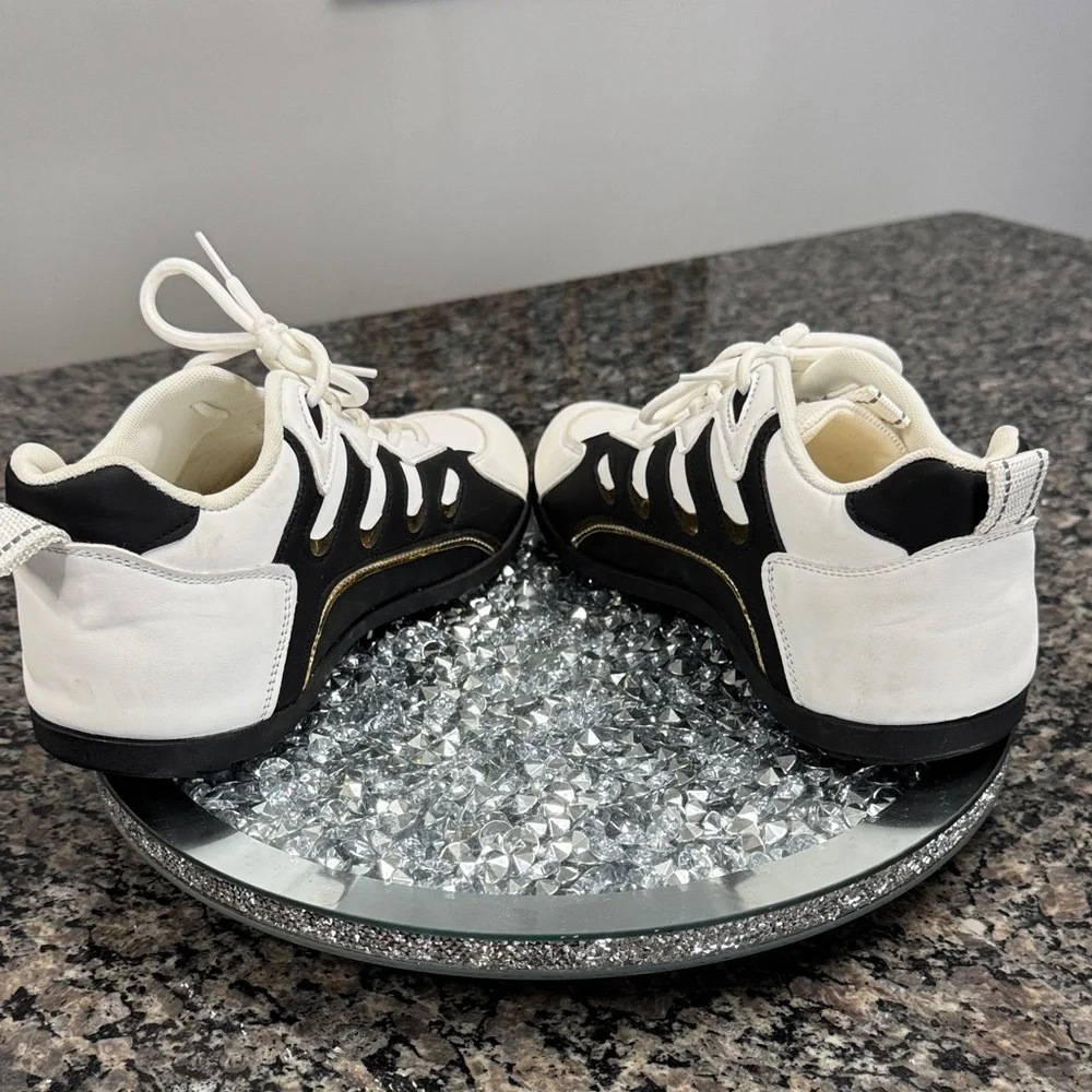 White and Black womens fashion Sneakers with gold accents EUC 10